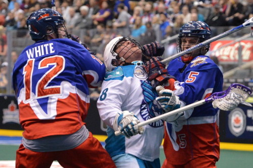 TORONTO, ON - APRIL 7: Toronto Rock players Chris White (left) and Sandy Chapman sandwich Rochester Knighthawks (middle) Cody Jamieson as the Toronto Rock host the Rochester Knighthawks in NLL action at the ACC. (Carlos Osorio/Toronto Star via Getty Images)