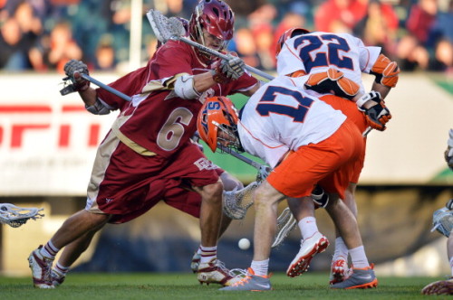 PHILADELPHIA, PA - MAY 25: Dylan Donahue #17 of the Syracuse University Orange goes for a loose ball while getting hit by Harley Brown #6 of the University of Denver Pioneers during a semifinal game of the 2013 NCAA Division I Men's Lacrosse Championships  at Lincoln Financial Field on May 25, 2013 in Philadelphia, Pennsylvania. Syracuse won 9-8. (Photo by Drew Hallowell/Getty Images)