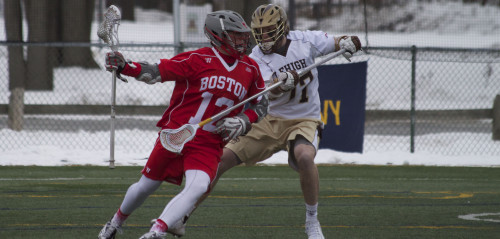 Corey Eppley, '16, a player on the men's lacrosse team, helped lead the defense in the game against Boston University. This was the first Patriot League game of the season and the Hawks won 10-9. (Liz Cornell/B&W photo)