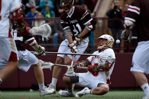 DENVER, CO - MAY 10: Brendan Caputo (41) of the Brown knocks Bryce Parietti (5) of the Denver to the turf during the first half of action. The University of Denver hosted Brown on Saturday, May 10, 2015. (Photo by AAron Ontiveroz/The Denver Post via Getty Images)