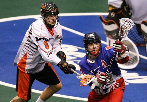 TORONTO, ON - JANUARY 23: Toronto, Canada - January 23 - In second quarter action, Toronto's Josh Sanderson is under pressure on the attack from Kevin Brownwell. The Toronto Rock take on the Buffalo bandits in their home opener in National Lacrosse League action at the Air Canada Centre. (Richard Lautens/Toronto Star via Getty Images)