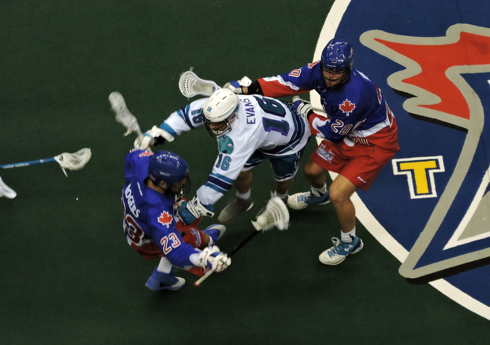 Dylan Evans of the Rochester Knighthawks gets caught between Challen Rogers and Bradley Kri of the Toronto Rock on January 28, 2017 at the Air Canada Centre. (Photo credit: Anna Taylor)