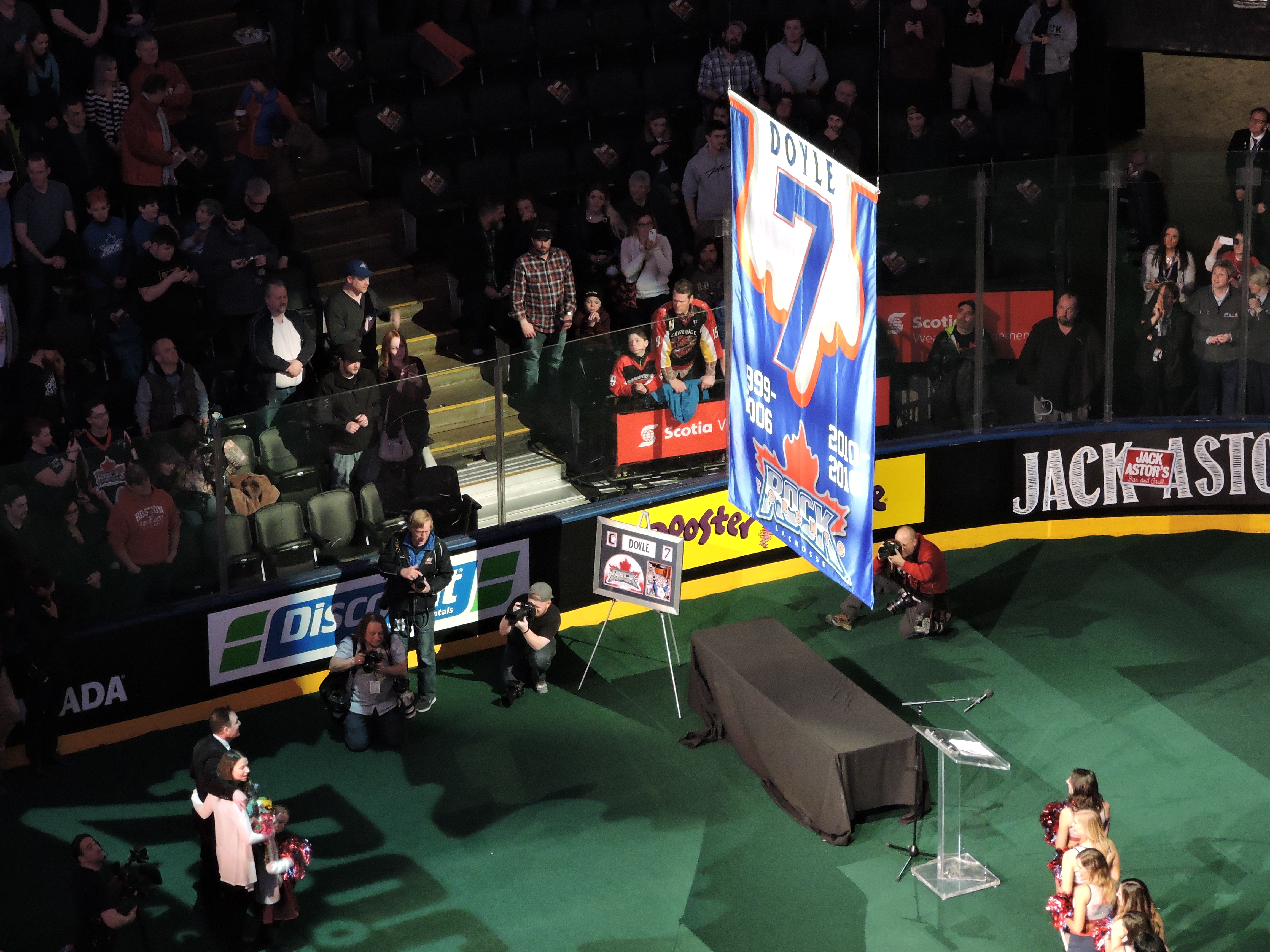 Colin Doyle watches his banner being raised to the ACC rafters on March 11, 2017. (Photo credit: Anna Taylor)