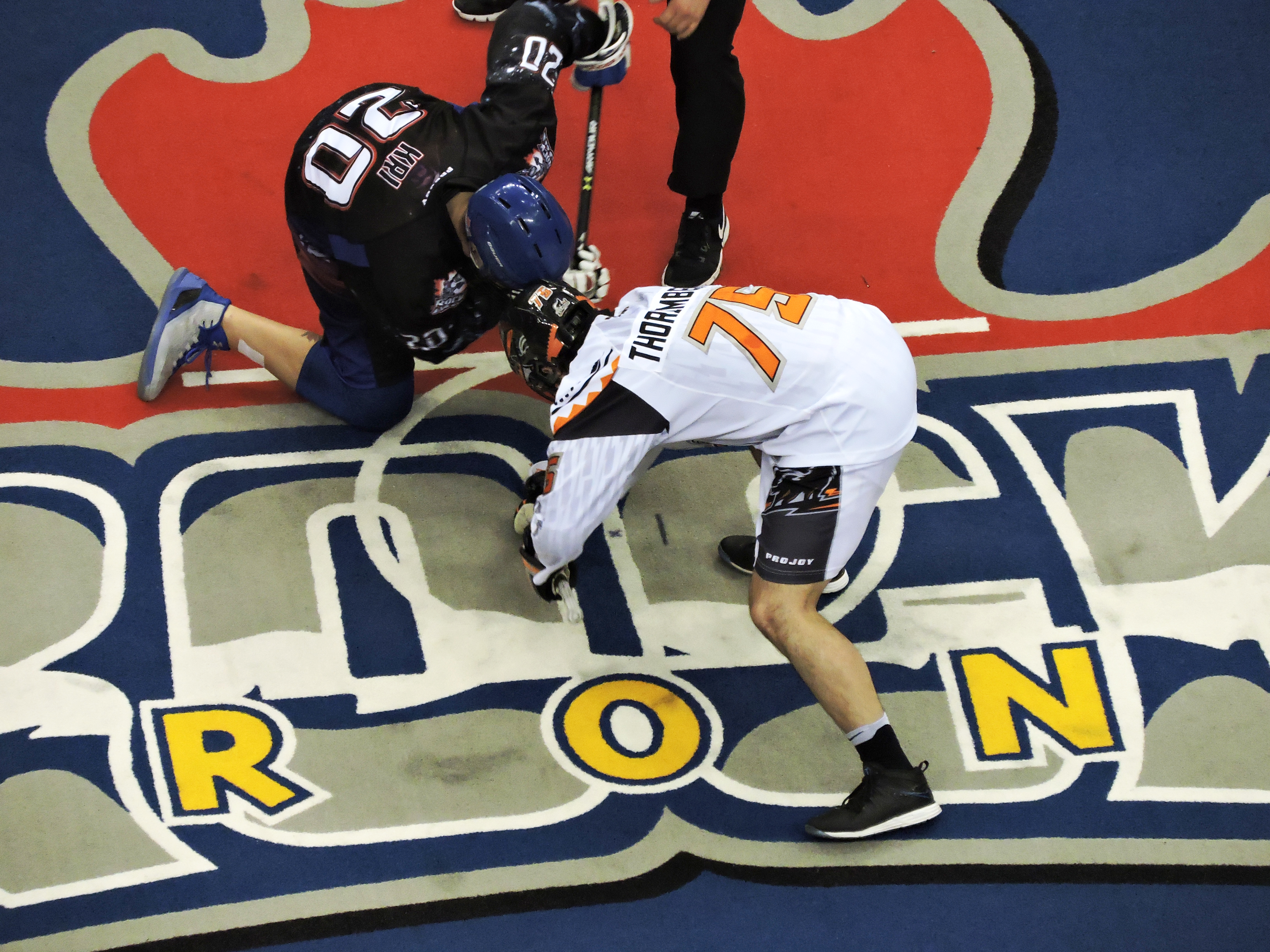 Jay Thorimbert of the New England Black Wolves faces off against Bradley Kri of the Toronto Rock on March 3, 2017 at the Air Canada Centre. (Photo: Anna Taylor)