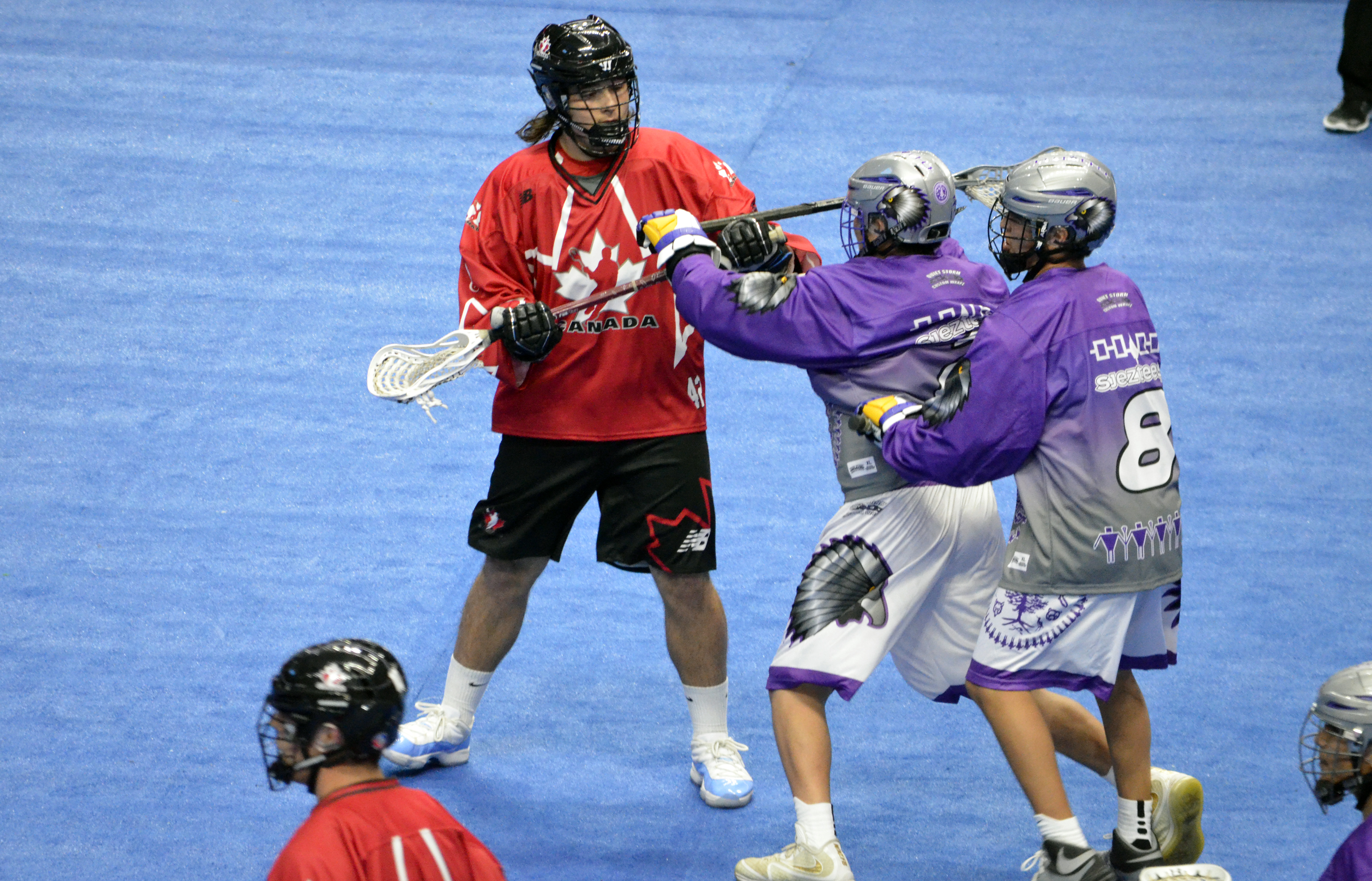 Roman Smoot of Team Canada battles against Team Haudenosaunee during the 2017 U17 Heritage Cup in Hamilton, Ont. (Photo credit: Anna Taylor)