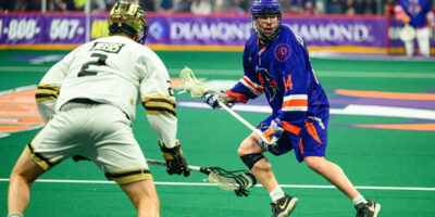 Halifax Thunderbird Ryan Terefenko carries the ball as Vancouver Warriors defender Matt Beers guards him.