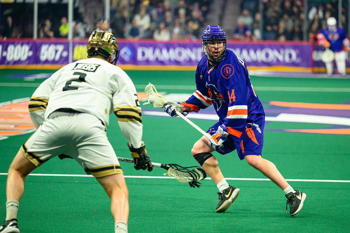 Halifax Thunderbird Ryan Terefenko carries the ball as Vancouver Warriors defender Matt Beers guards him. 